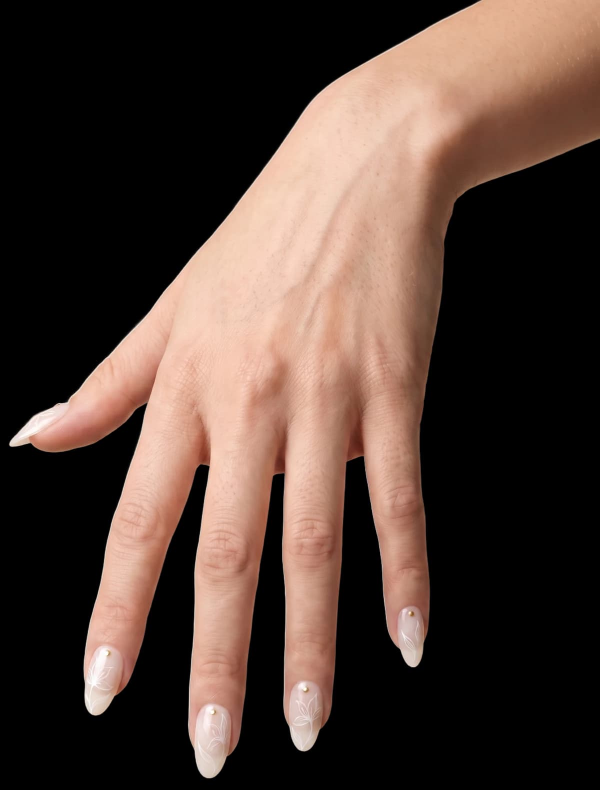 The same hand wearing the Lily Blanc press-on set